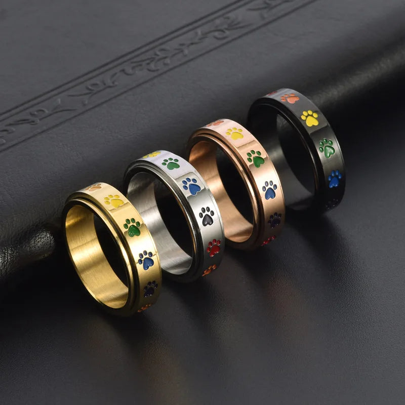 Anillo Giratorio Antiestrés Con Diseño De Pata – Acero Inoxidable Con Huellas De Patas Arcoíris