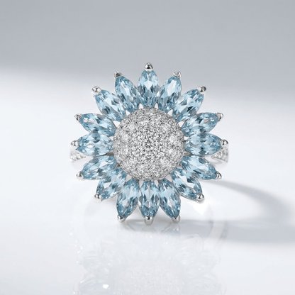 ANILLO DE FLOR DE TOPACIO AZUL Y PLATA