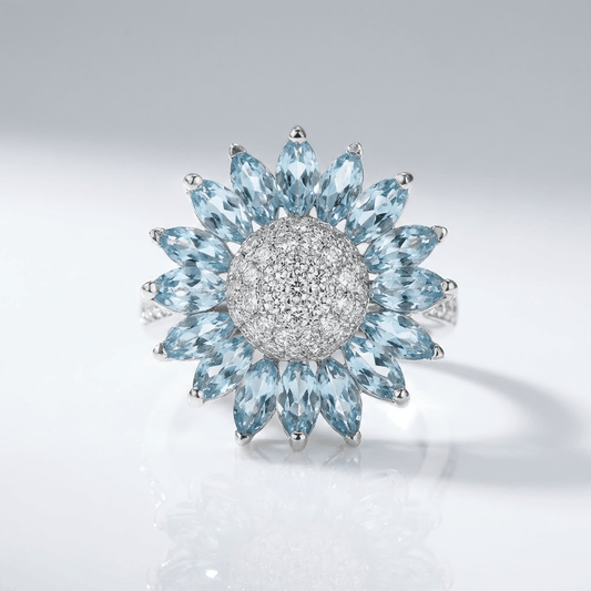 ANILLO DE FLOR DE TOPACIO AZUL Y PLATA