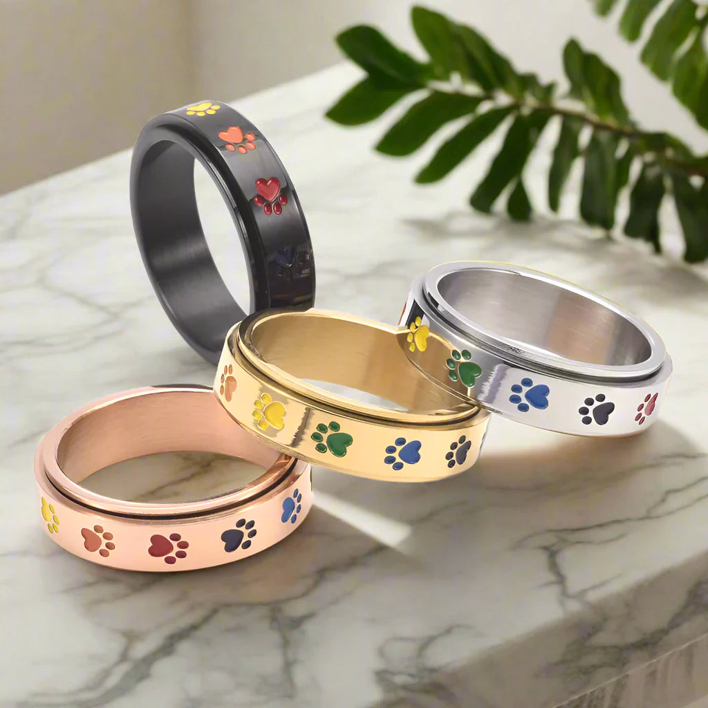 Anillo Giratorio Antiestrés Con Diseño De Pata – Acero Inoxidable Con Huellas De Patas Arcoíris